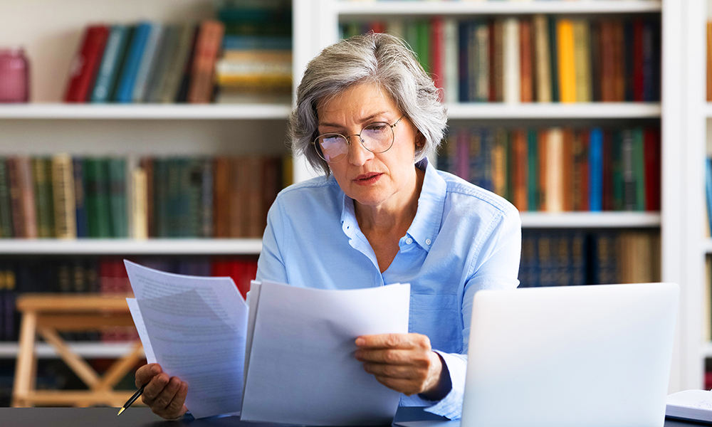 Women reading regulatory material