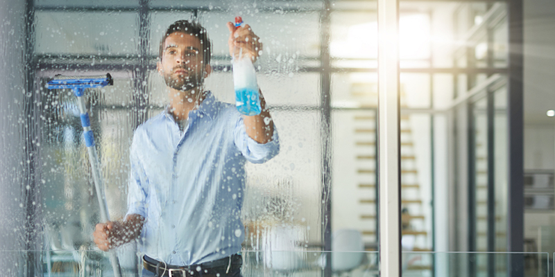 man cleaning windows